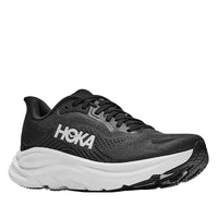 Black Hoka running shoe on a white background