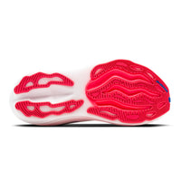 Close-up of a shoe sole with red and white design on a white background