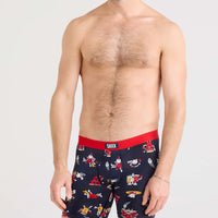 Man wearing navy boxer briefs with red waistband and cartoon designs on a white background