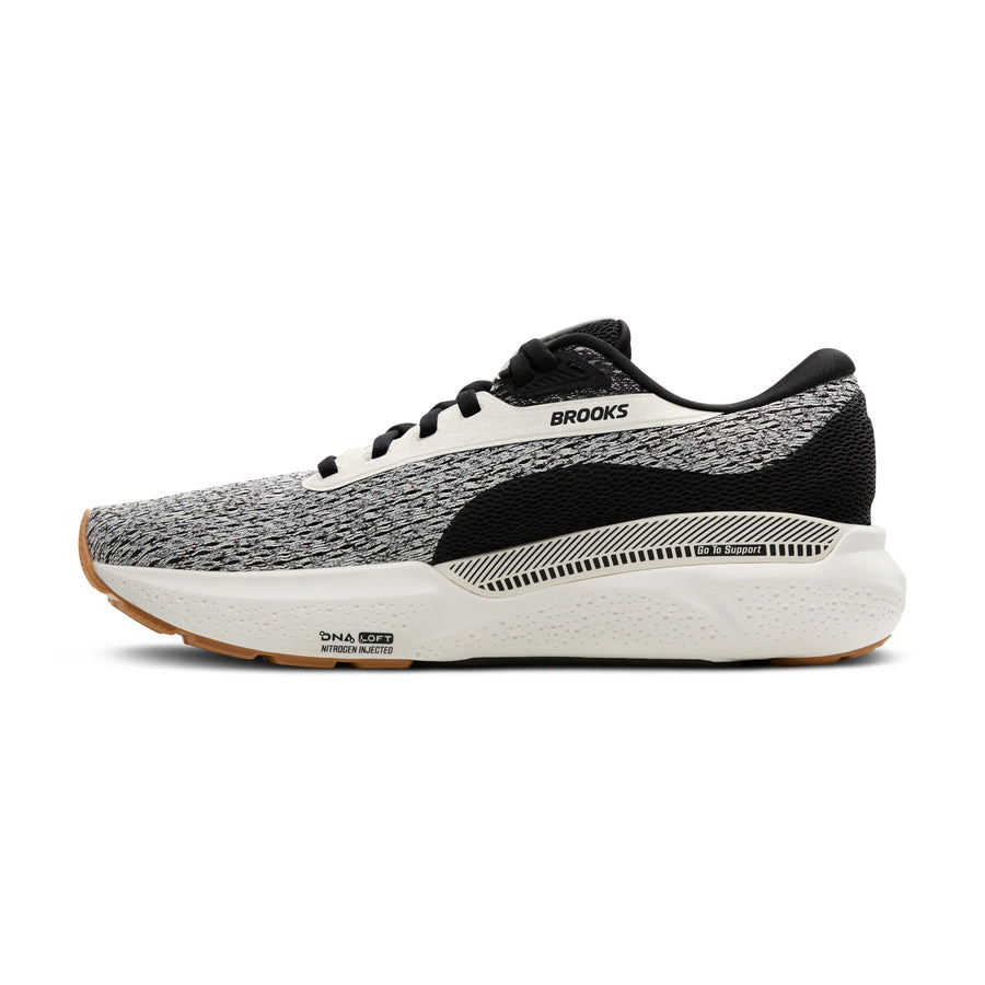Black and gray running shoe with 'Brooks' branding on a white background