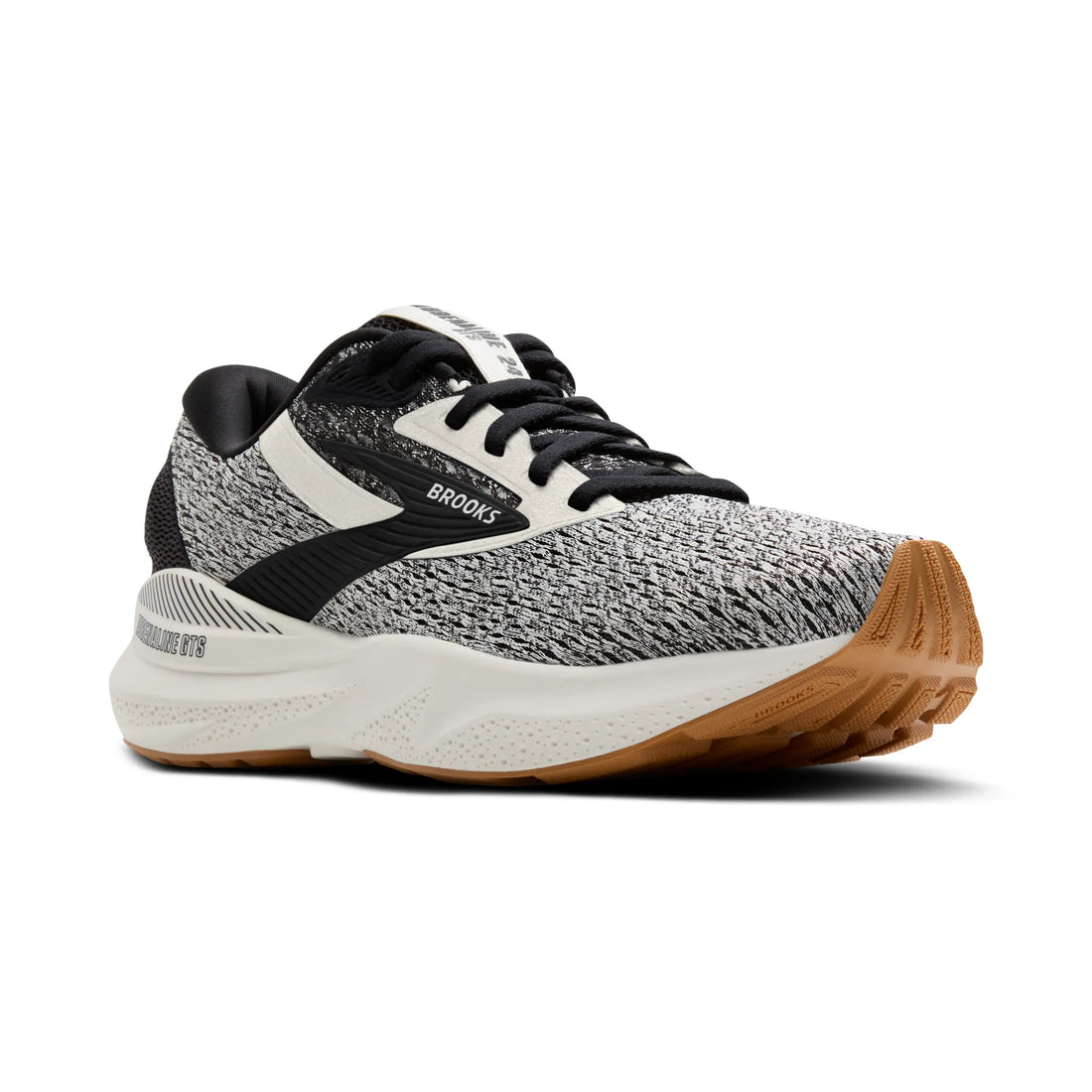 Gray and black running shoe with brown sole on a white background