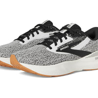 Gray and black running shoes with white soles on a white background