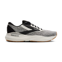 Black and gray running shoe with white sole on a white background