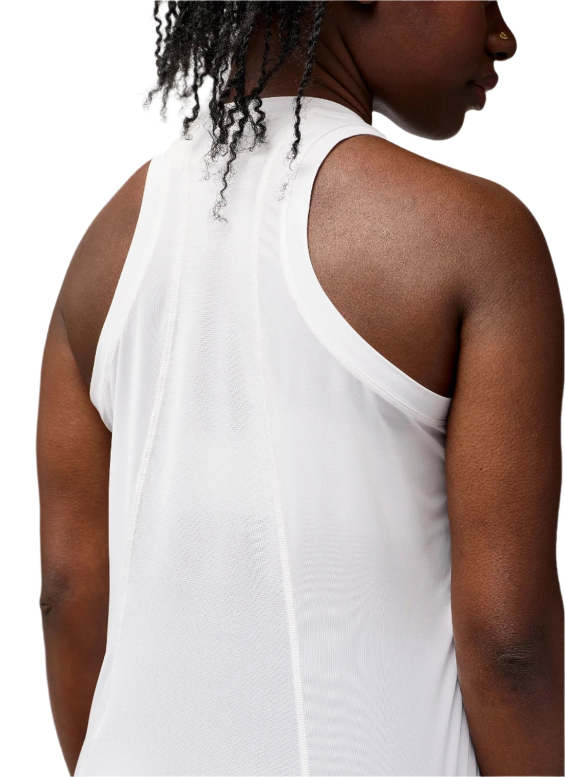 Person wearing a white sleeveless top against a plain background
