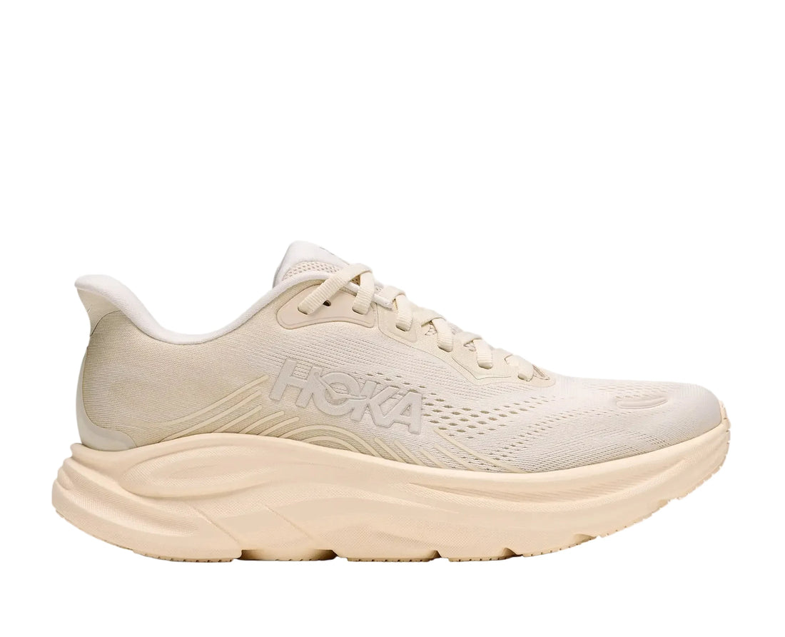 Beige running shoe with 'Hoka' branding on a white background